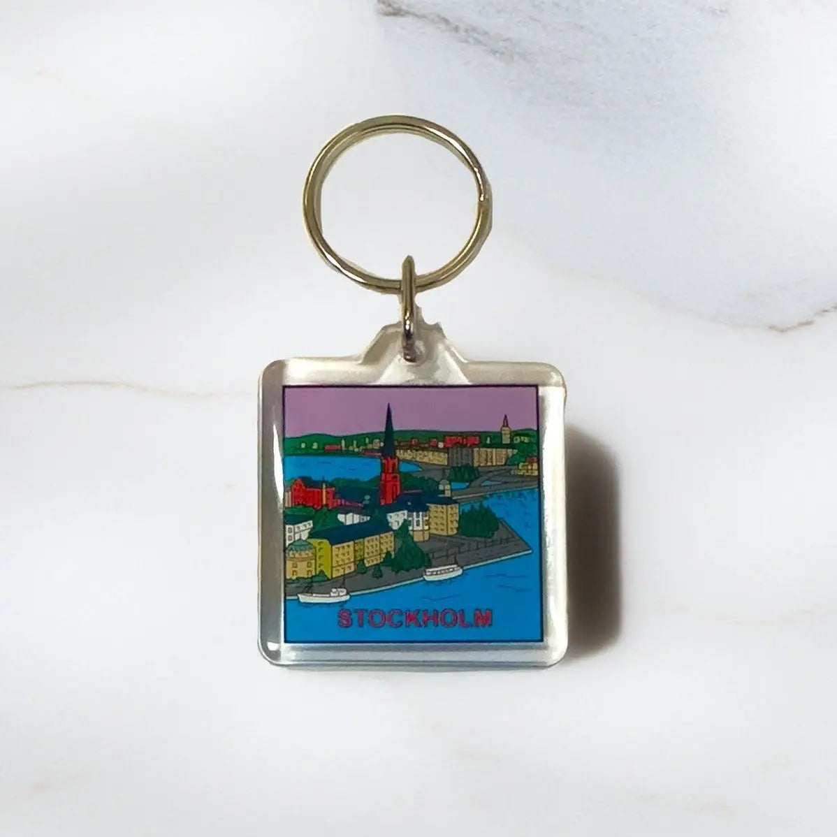 Colorful Stockholm Riddarholmen Areylic Keyring featuring a detailed cityscape design. - Style Council