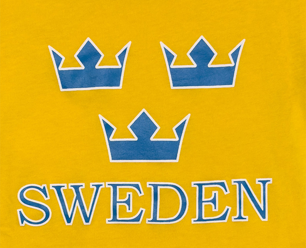 Design Details of  Vibrant yellow Sweden Three Crown Kids' T-Shirt featuring iconic blue crowns and bold "SWEDEN" text. - Style Council