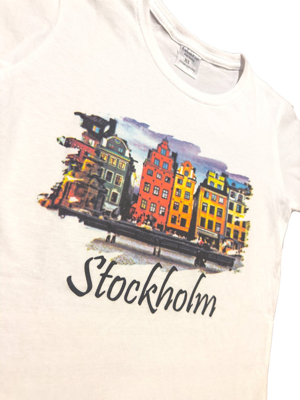 Side View of Stockholm souvenir Women’s Classic T-shirt featuring a colorful Stortorget print from Gamla Stan Old Town. - Style Council