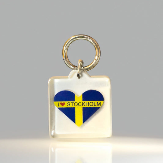 Front angle of heart-shaped I Heart Stockholm keyring with Swedish flag in clear acrylic design
